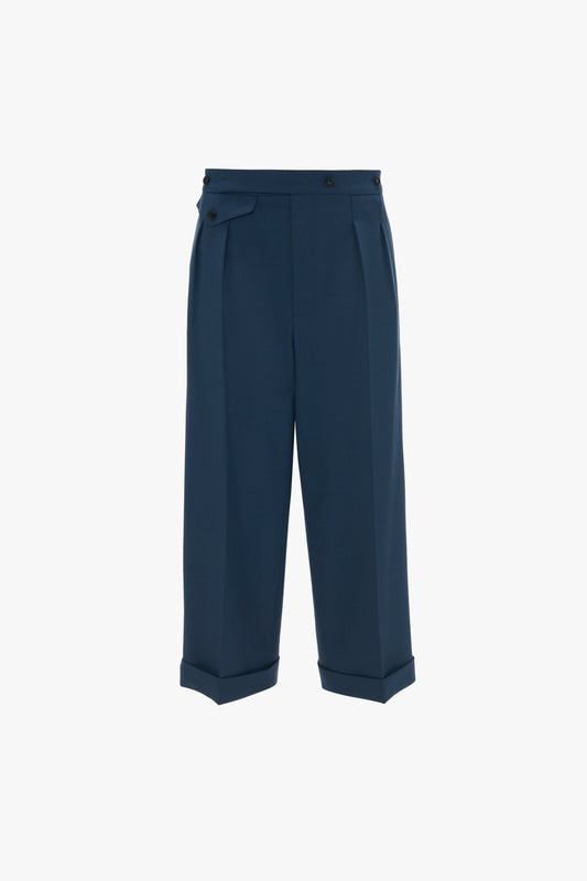 Wide Leg Cropped Trouser In Heritage Blue by Victoria Beckham with pleats and a recycled wool belt detail, isolated on a white background.