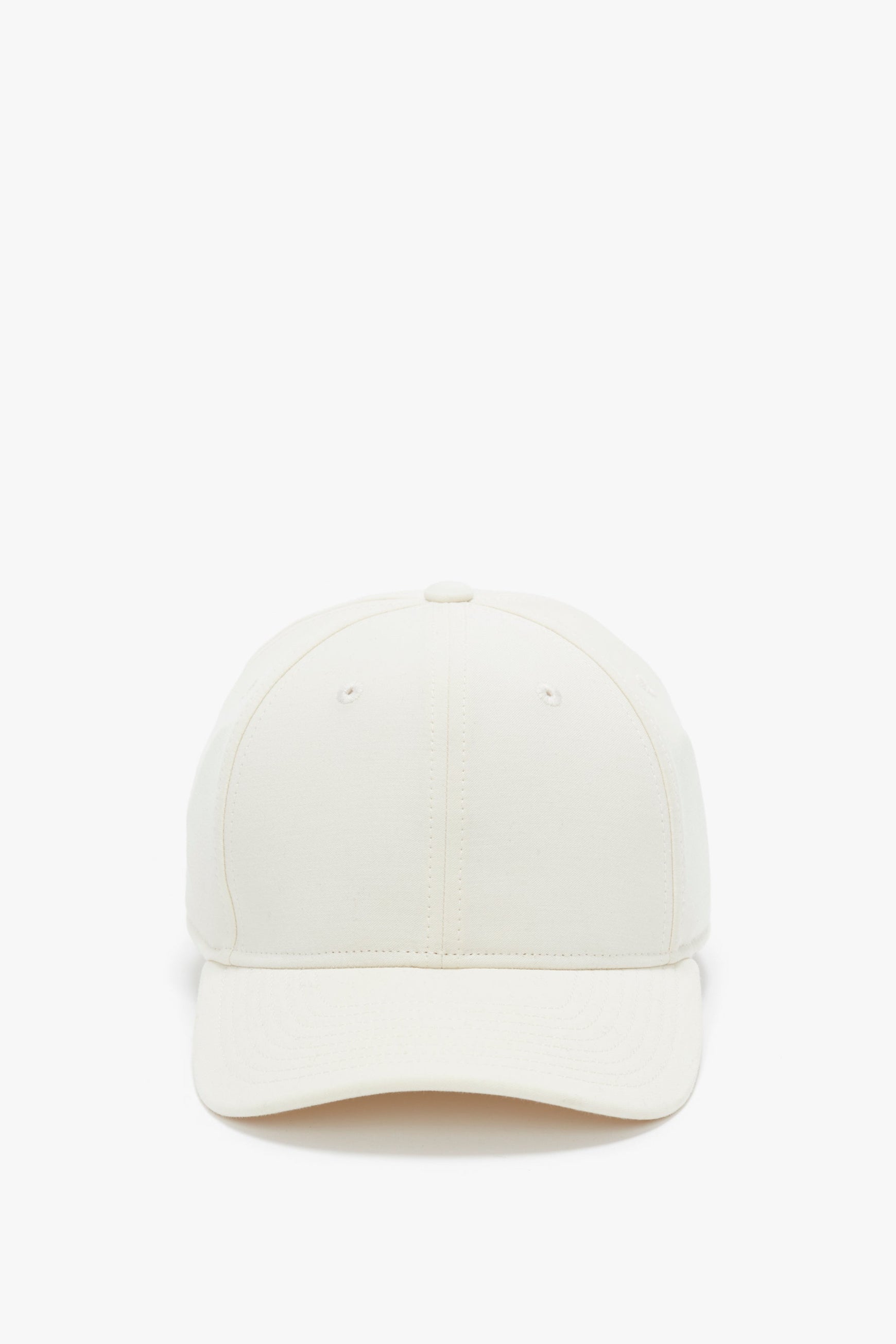 Front view of a Victoria Beckham Antique White Logo Cap isolated on a white background.