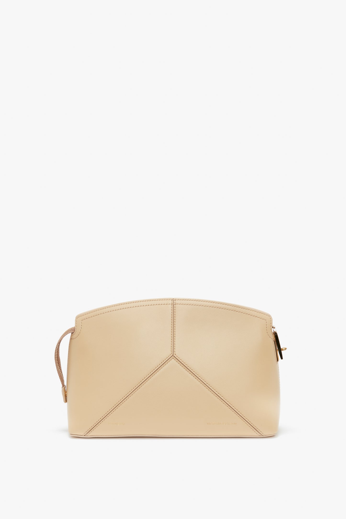 A Victoria Beckham Victoria Clutch Bag In Sesame Leather with a geometric design, featuring a structured body and a top zip closure.