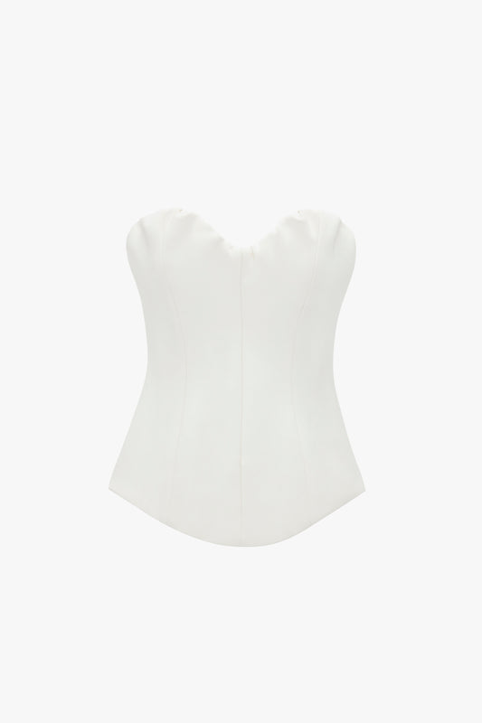 White strapless Corset Top In Antique White with a sweetheart neckline on a white background by Victoria Beckham.