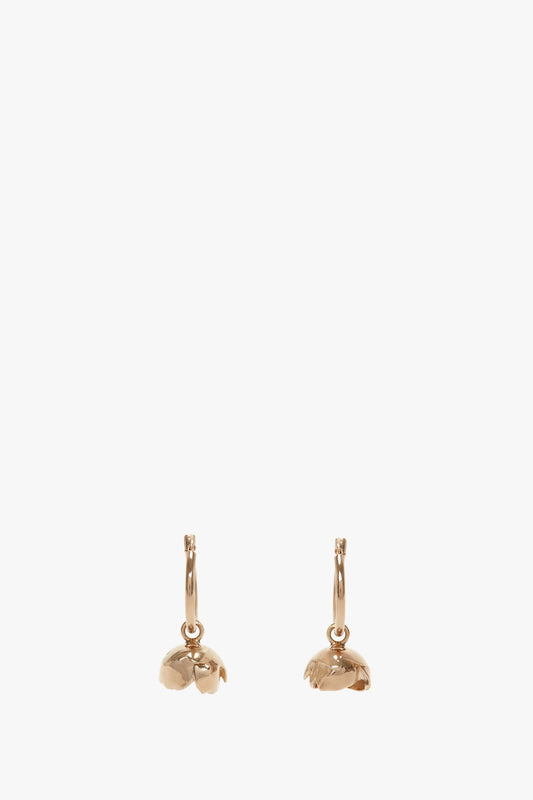 A pair of Exclusive Camellia Flower Hoop Earrings In Gold with Victoria Beckham, against a plain white background.
