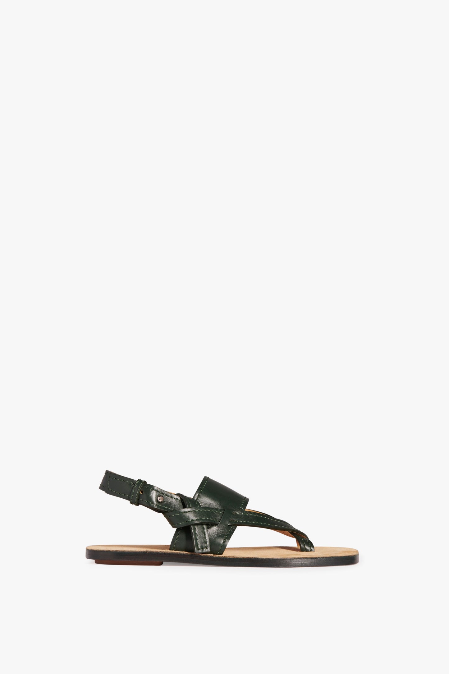 The Victoria Beckham Eve Flat Sandal in Bottle Green, featuring an oversized outsole, an adjustable strap, and an open toe design on a white background.