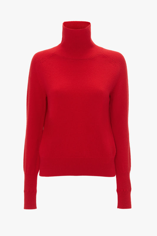 Victoria Beckham red lambswool polo neck jumper isolated on a white background.