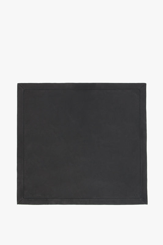 Foulard In Black Leather desk pad with a stitched border on a plain white background by Victoria Beckham.