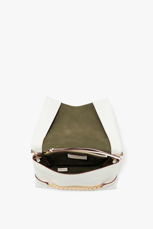White Victoria Beckham Chain Pouch with Strap in White Leather, open to display the interior and a brand label, against a white background.