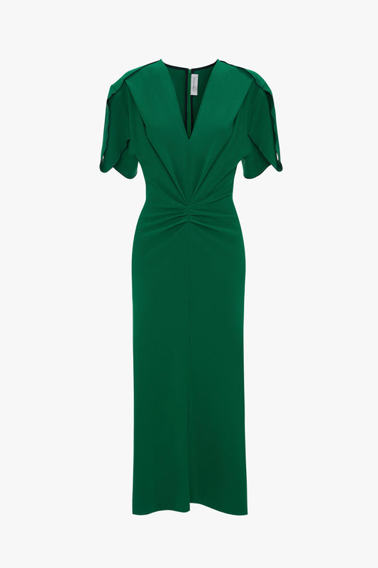 A green, knee-length Gathered V-Neck Midi Dress in Emerald with short ruffle sleeves and waist-defining pleat detail on a white background by Victoria Beckham.