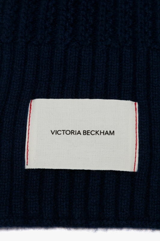 Close-up of a Victoria Beckham Exclusive Logo Patch Scarf In Navy.