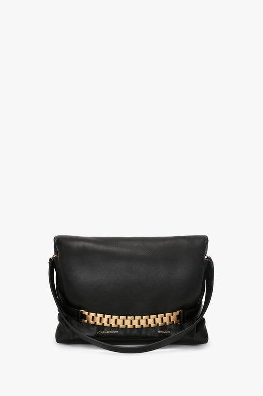 Puffy Chain Pouch With Strap in Black Leather by Victoria Beckham, displayed against a white background.