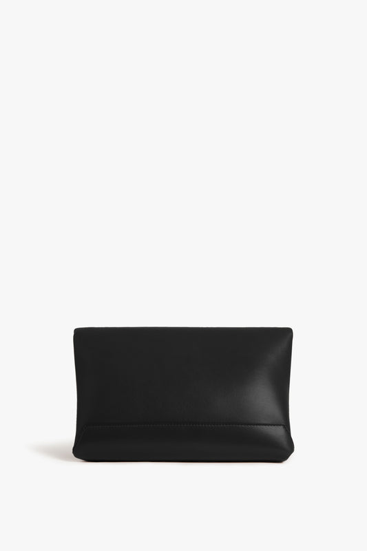 A Victoria Beckham black leather Chain Pouch Bag with gold-tone hardware on a white background.