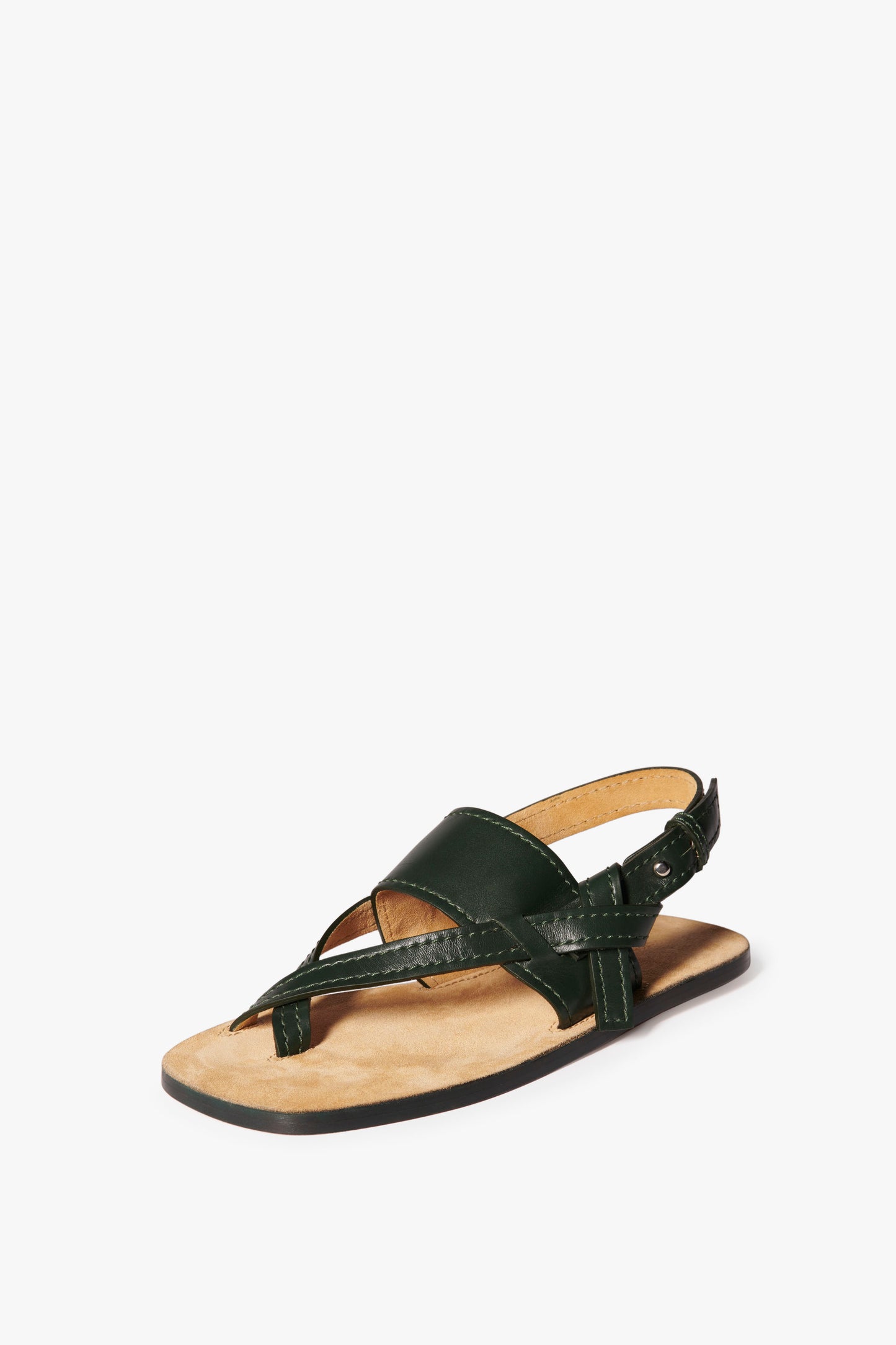 A single Eve Flat Sandal in Bottle Green by Victoria Beckham on a plain white background, featuring a strap design that crosses over the foot with an adjustable ankle strap and an oversized outsole for added flair.