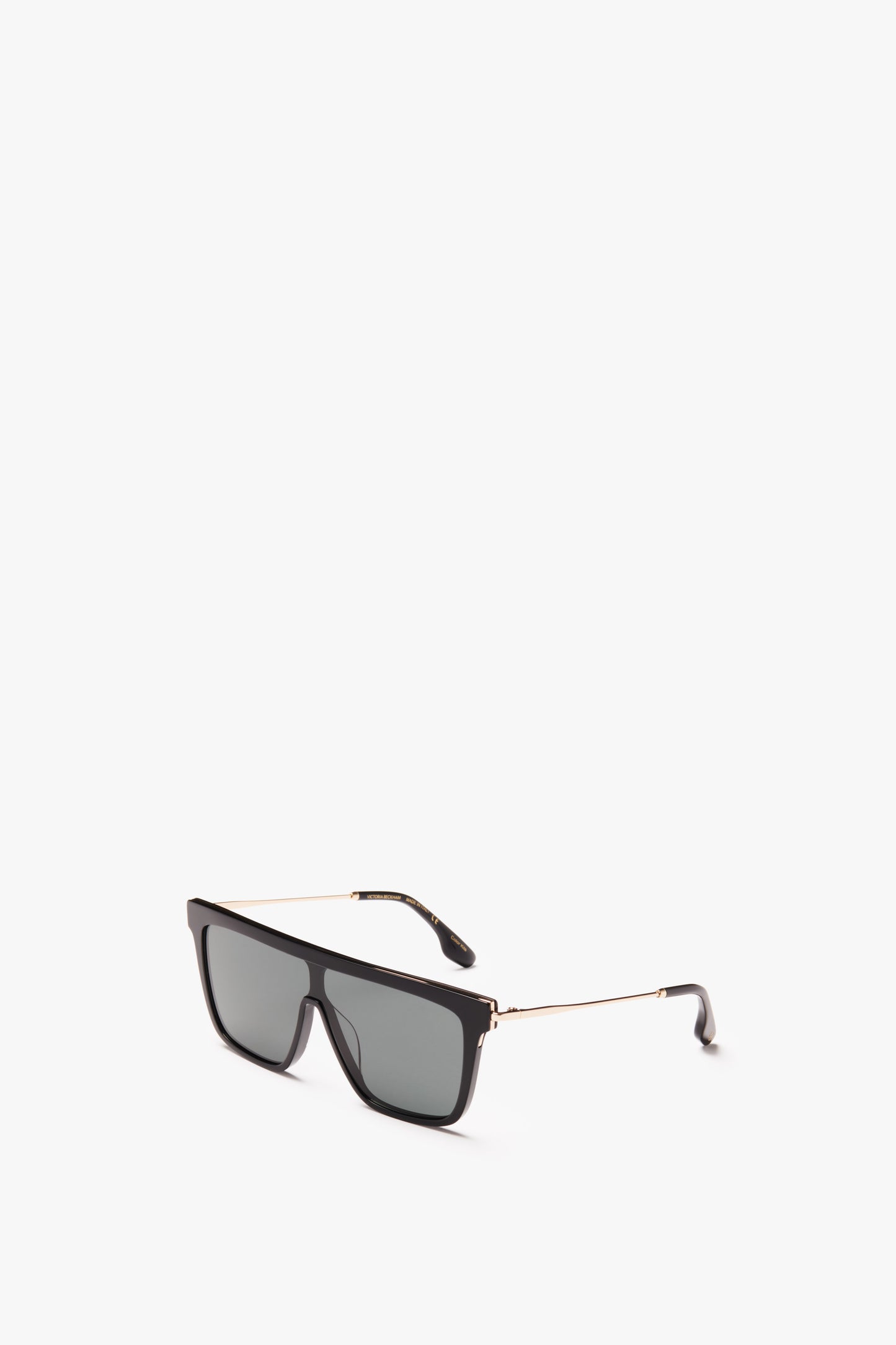 A pair of all-black Victoria Beckham Rectangular Shield Sunglasses with gold detailing on the arms, isolated on a white background.