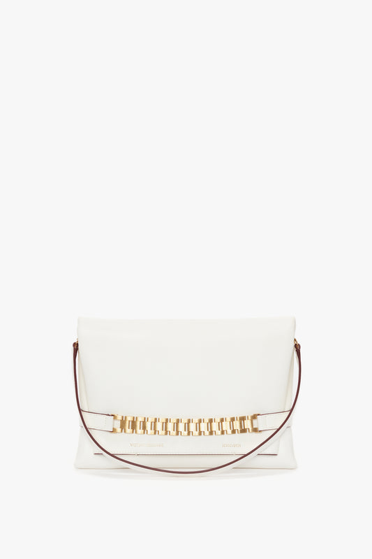 White Chain Pouch with Strap In White Leather by Victoria Beckham with a gold chain detail and Nappa leather on a white background.