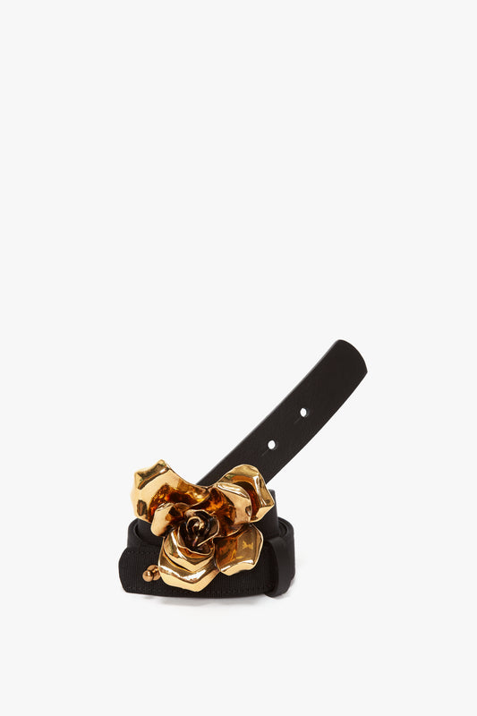A Victoria Beckham Exclusive Flower Belt In Black And Gold, displayed against a white background.