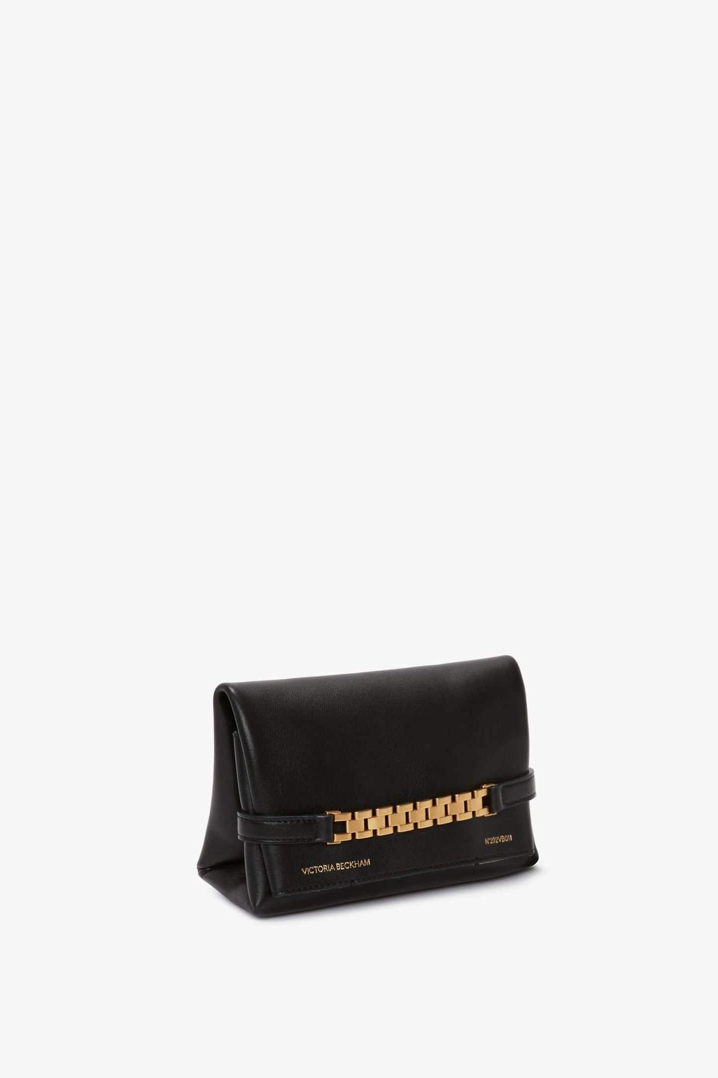 A Mini Chain Pouch Bag With Long Strap In Black Leather with a gold chain accent and the text "Victoria Beckham" on the bottom right corner.