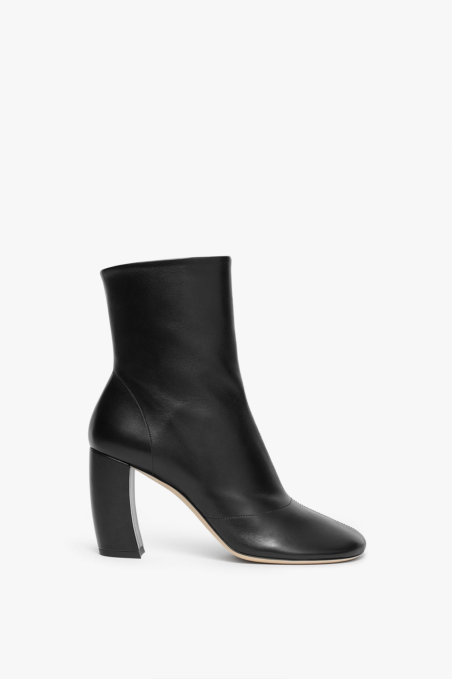 A Victoria Beckham Capri Ankle Boot 85mm in Black with a rounded toe and high banana heel, displayed against a plain white background.