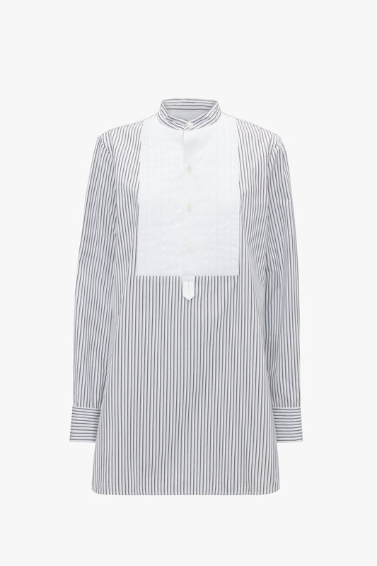 Long-sleeved, Tuxedo Bib Shirt in Black and Off-White featuring a white bib front and a stand collar with a button-up closure, offering a relaxed look perfect for modern menswear silhouettes by Victoria Beckham.