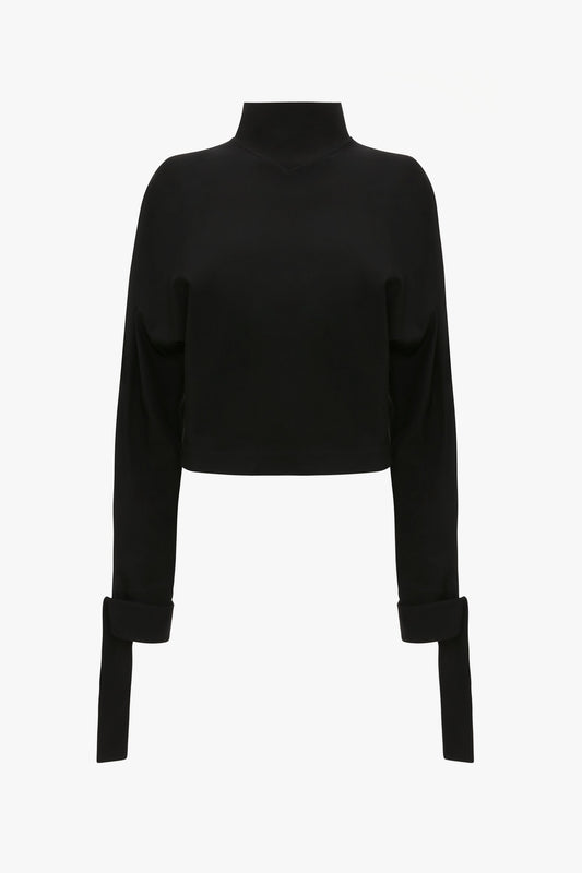 Tie Sleeve Ponti Top In Black by Victoria Beckham with an oversized slouchy fit, high neckline, and extended cuffs, displayed on a plain white background.