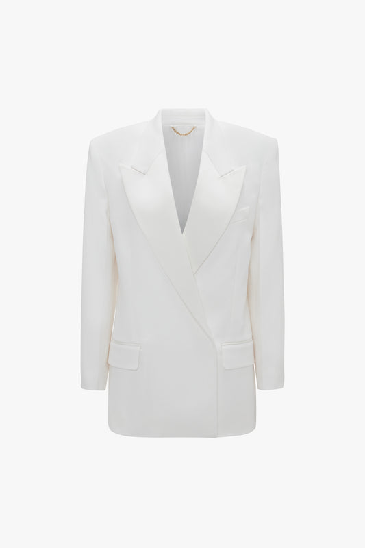 An Exclusive Double Breasted Tuxedo Jacket In Ivory by Victoria Beckham with peaked lapels and two front pockets, perfect for black-tie occasions, displayed on a plain white background.