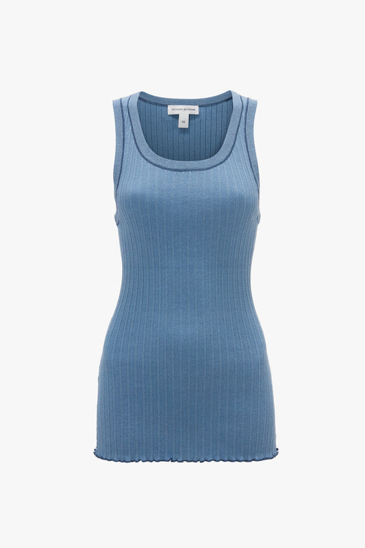 A sleeveless, ribbed, heritage blue tank top with a rounded neckline against a plain white background, reminiscent of Victoria Beckham's Fine Knit Micro Stripe Tank In Heritage Blue designs.