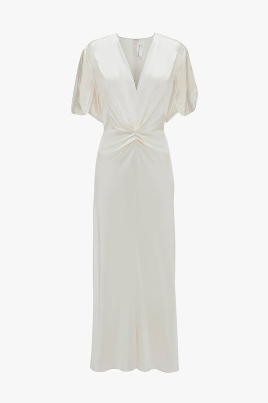 A white, short-sleeved Victoria Beckham Gathered V-Neck Midi Dress In Ivory with a twisted knot detail at the waist and a slight flare at the bottom.