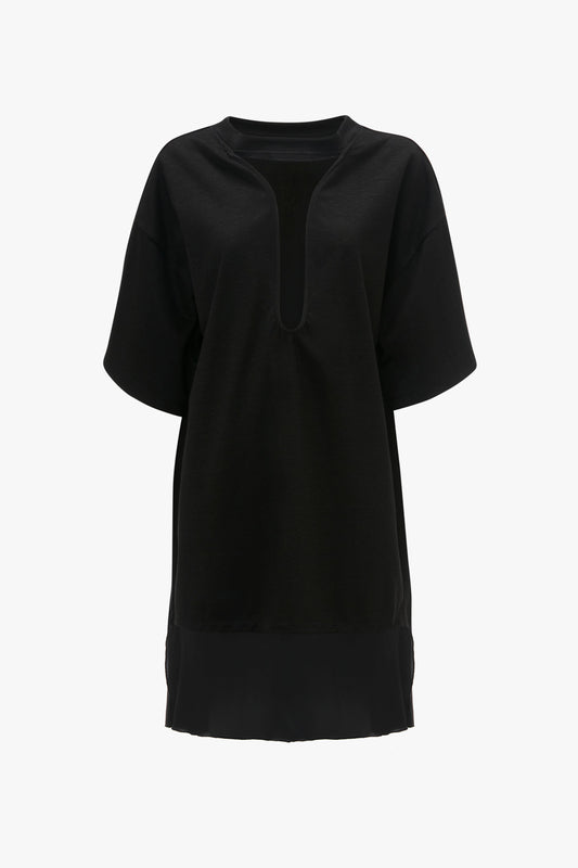 A Victoria Beckham Frame Cut-Out T-Shirt Dress In Black is shown against a white background.