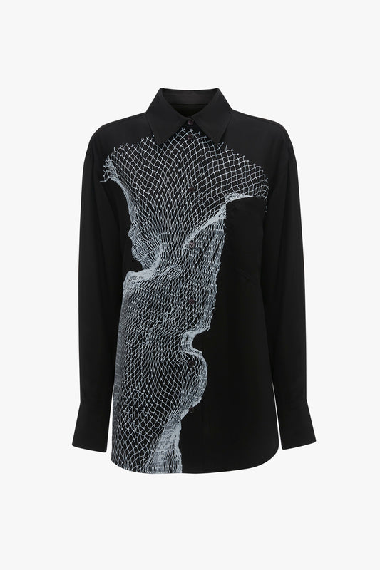 A black long-sleeved relaxed-fit masculine shirt with a white graphic twisted net print on the front. The shirt features a classic pinsharp collar and buttoned cuffs. Introducing the Long Sleeve Pyjama Shirt In Black-White Contorted Net by Victoria Beckham.