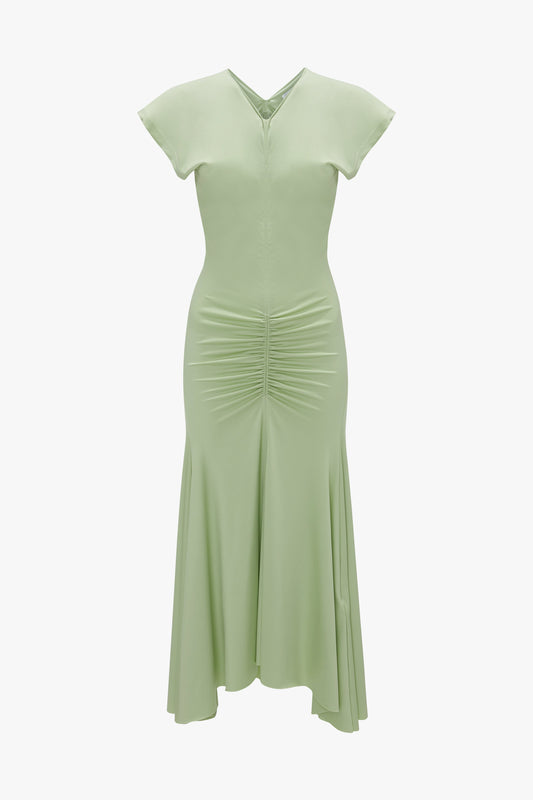 Victoria Beckham's Sleeveless Ruched Jersey Dress in Pistachio with v-neckline and short sleeves on a plain white background.