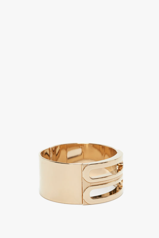 A sleek design defines the Exclusive Frame Bracelet In Gold by Victoria Beckham, featuring a double-bar cutout on one side, reminiscent of the refined elegance of a Victoria Beckham logo.