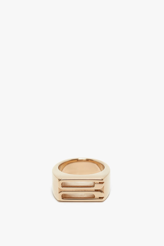 Exclusive Frame Signet Ring In Gold by Victoria Beckham with a modern, geometric design on a white background.