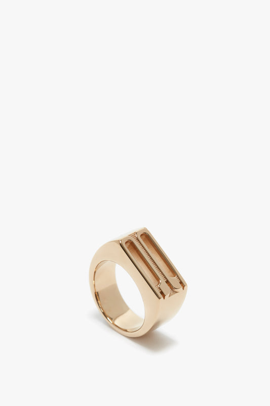 A polished gold-coated brass Exclusive Frame Signet Ring In Gold displayed against a plain white background by Victoria Beckham.