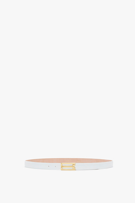 A slim white calf leather Exclusive Frame Belt by Victoria Beckham with a gold buckle, centered on a plain white background.