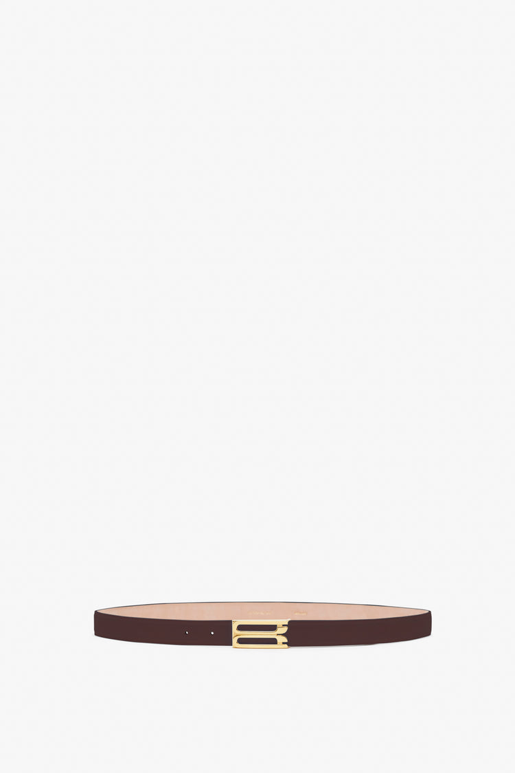 Thin calf leather belt in burgundy with a gold-colored rectangular buckle, the Frame Belt In Burgundy Leather by Victoria Beckham.
