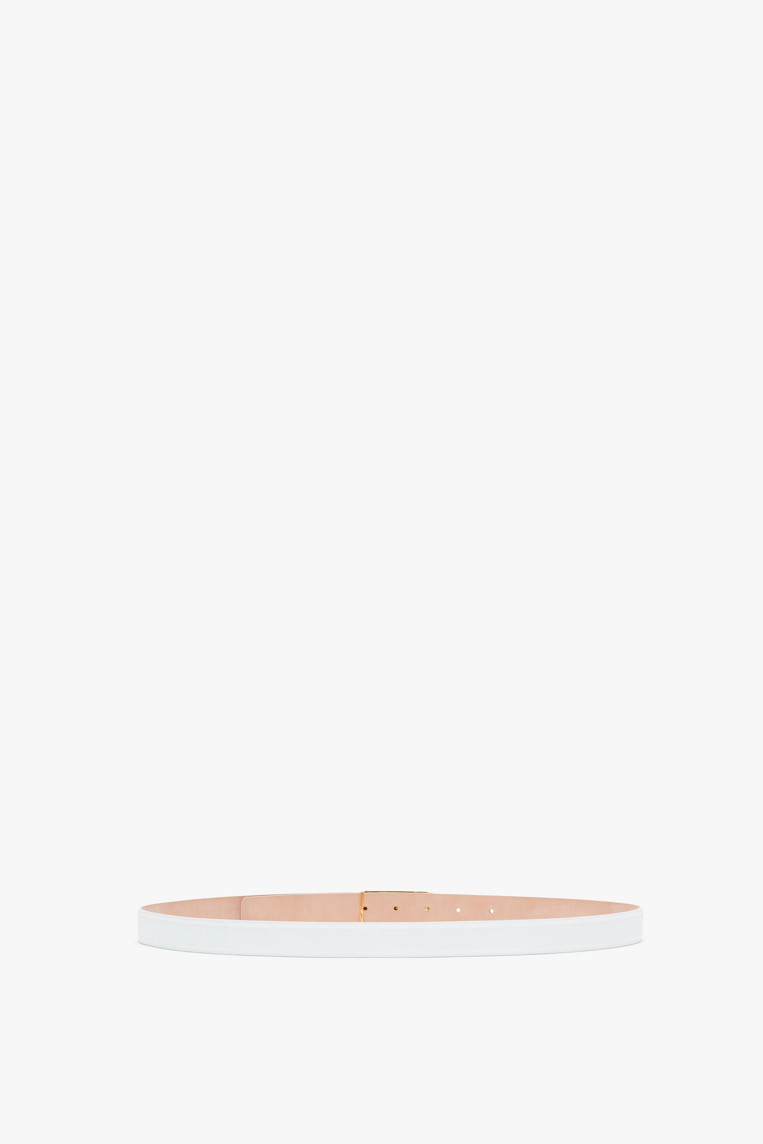 A thin, light beige Victoria Beckham Frame Belt In White Leather made of smooth calf leather, featuring a white outer side and a small gold-colored buckle, displayed on a white background.