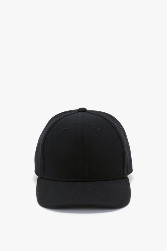 A plain black wool crepe Exclusive Logo Cap In Black by Victoria Beckham facing forward against a white background.