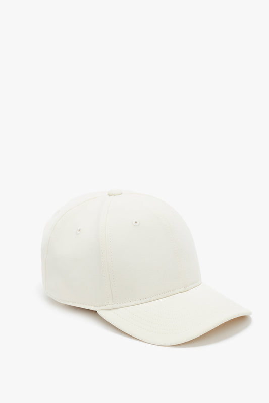 A plain white Victoria Beckham logo cap positioned frontally on a white background.