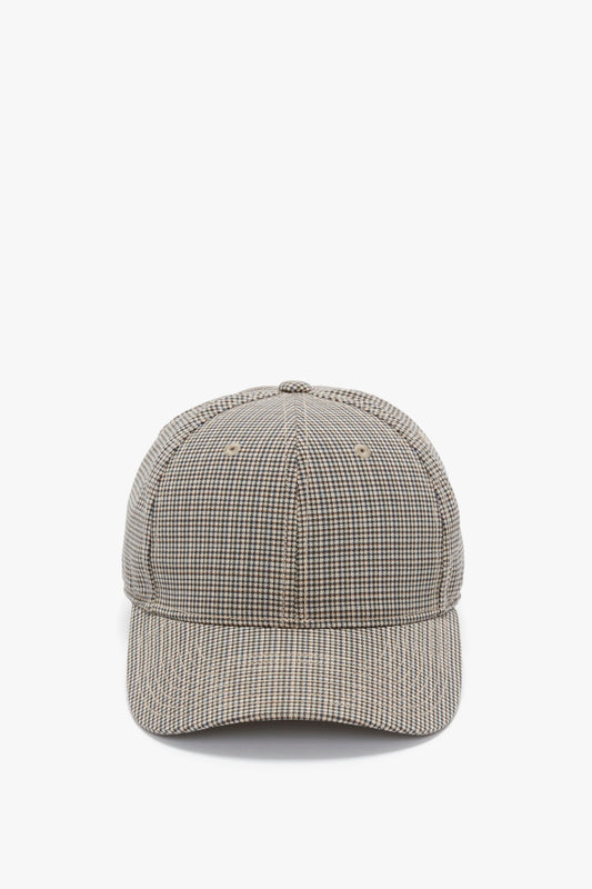 A Logo Cap In Dogtooth Check by Victoria Beckham facing front, displayed against a white background, features an adjustable plastic snap.