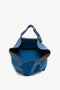 The Victoria Beckham W11 Medium Tote Bag In Vibrant Blue, boasting two straps and a small inner pocket.