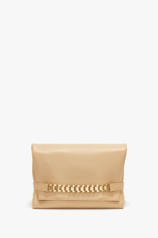 A beige leather crossbody bag with a decorative gold chain on a white background. 
Product Name: Victoria Beckham Chain Pouch With Strap In Sesame Leather