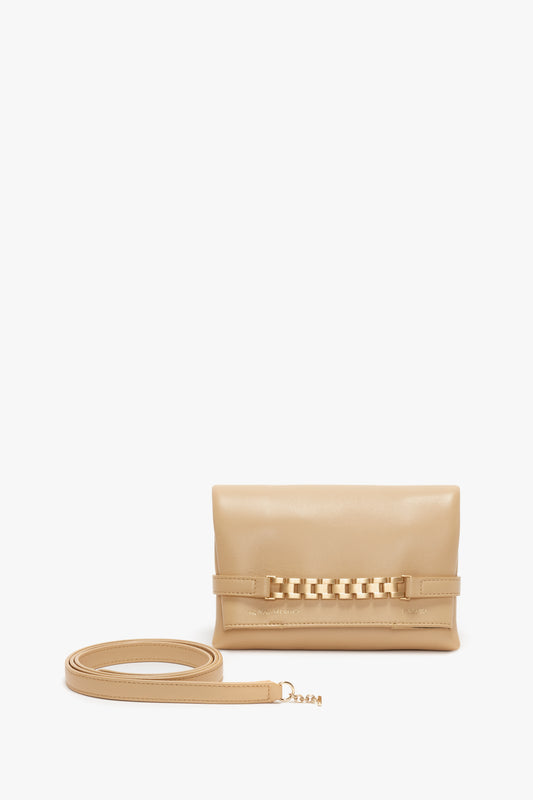 Beige leather crossbody shoulder bag with a chain-link detail on the flap and a detachable long strap, displayed against a white background.
Product Name: Mini Pouch With Long Strap In Sesame Leather
Brand Name: Victoria Beckham