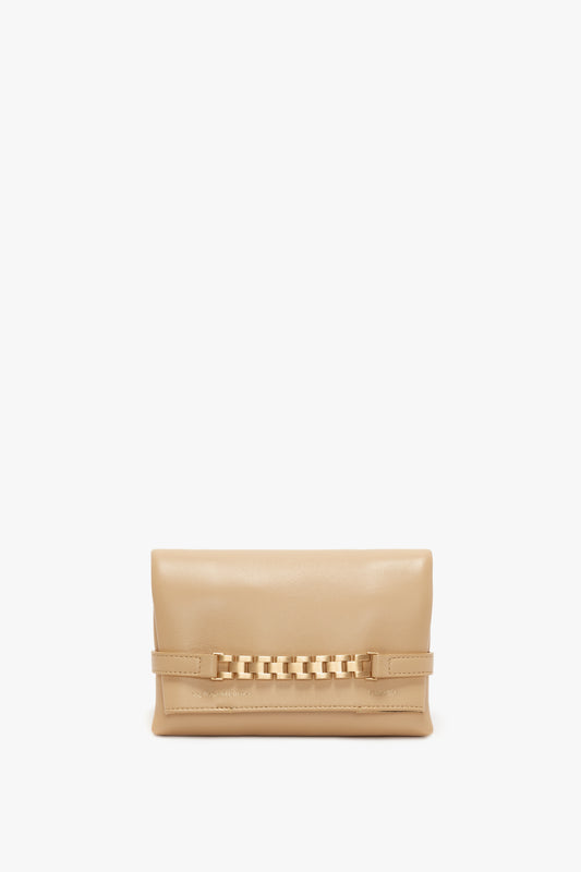 A Mini Pouch With Long Strap In Sesame Leather by Victoria Beckham, with a decorative, gold-toned chain detail and displayed against a white background.
