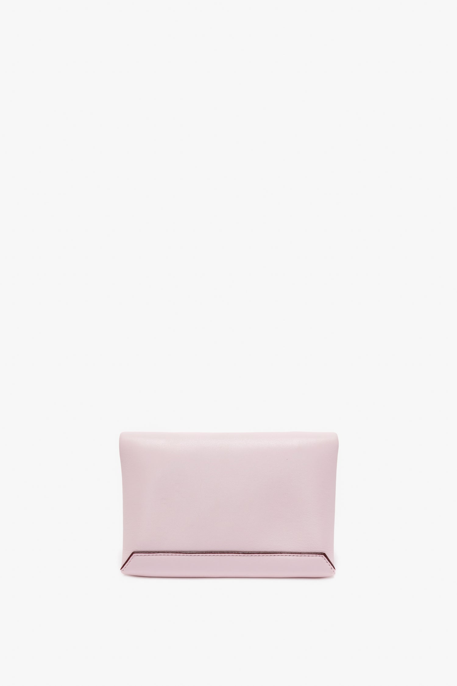 A Mini Chain Pouch Bag With Long Strap In Orchid Leather by Victoria Beckham, with a minimalist design, reminiscent of an orchid's delicate hue, sits elegantly against a white background.