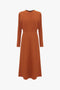 A Victoria Beckham Dolman Midi Dress in Russet with a fitted waist and flared skirt, displayed on a plain white background.