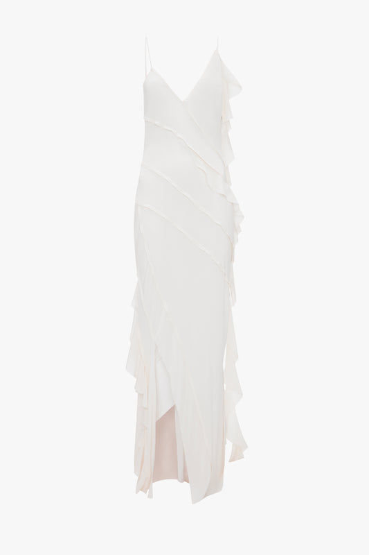 An elegant white Exclusive Asymmetric Bias Frill Dress In Ivory by Victoria Beckham, with layered ruffles and lace detail, displayed against a white background.