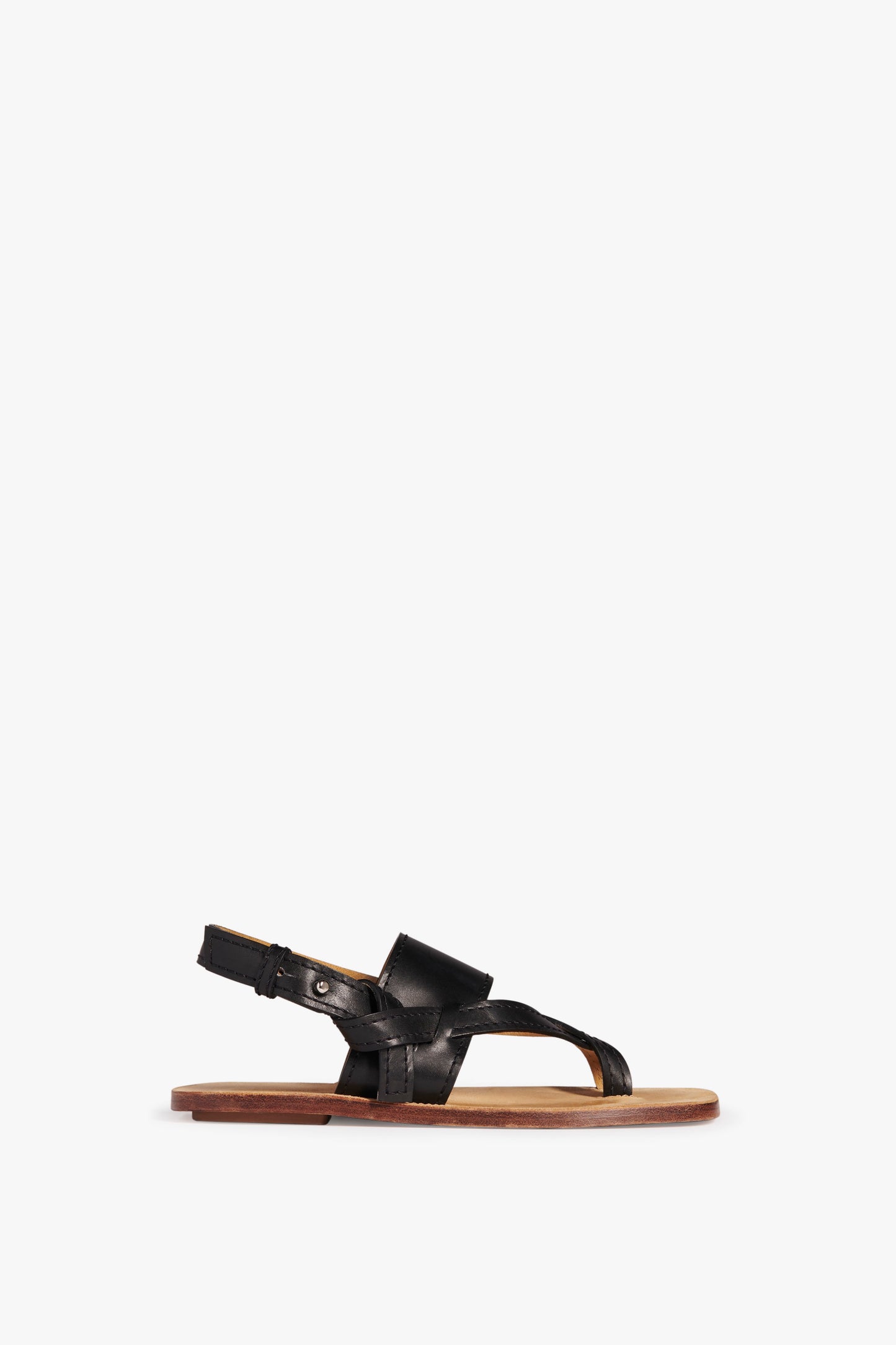 The Victoria Beckham Eve Flat Sandal in Black features black calf leather with a flat sole and an adjustable ankle strap.