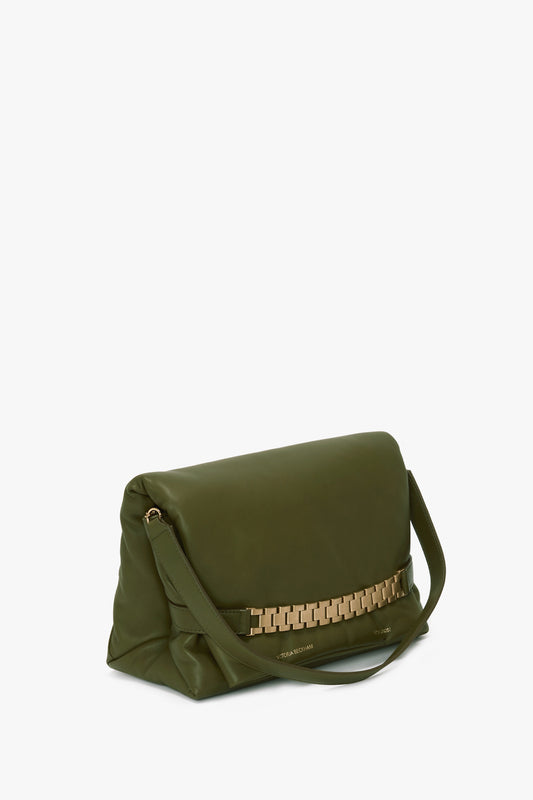 A Puffy Chain Pouch With Strap In Khaki Leather with a fold-over flap and gold chain detail, featuring a puffy chain pouch design, single shoulder strap, and minimal branding at the base by Victoria Beckham.