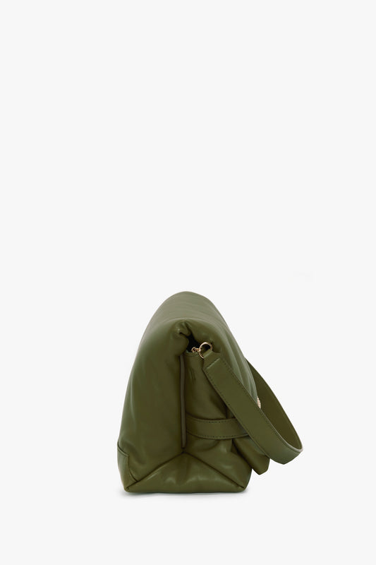 A side view of a green leather Victoria Beckham Puffy Chain Pouch With Strap In Khaki Leather, standing on a white surface.
