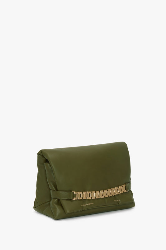 Puffy Chain Pouch With Strap In Khaki Leather with a rectangular shape, featuring a gold chain detail across the front and "Victoria Beckham" printed on the bottom right corner.