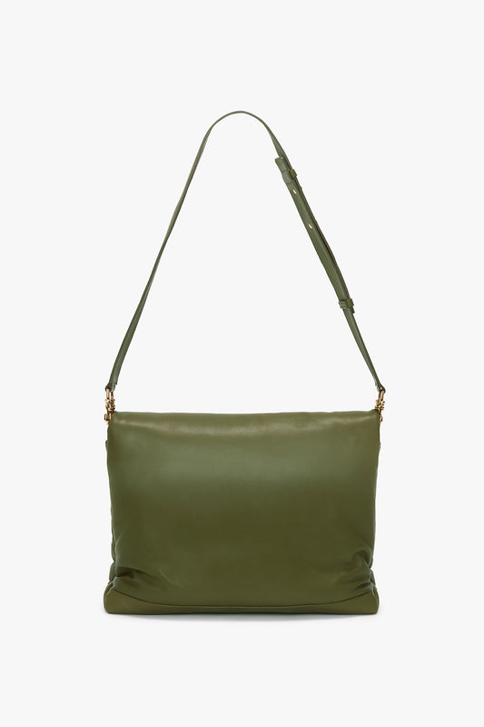 A large, olive green sheepskin nappa leather shoulder bag with an adjustable strap and gold-tone hardware against a plain white background.
With:
Puffy Jumbo Chain Pouch In Khaki Leather by Victoria Beckham