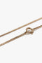 Close-up image of a Victoria Beckham Exclusive Long Fine Chain In Gold with a spring ring clasp.