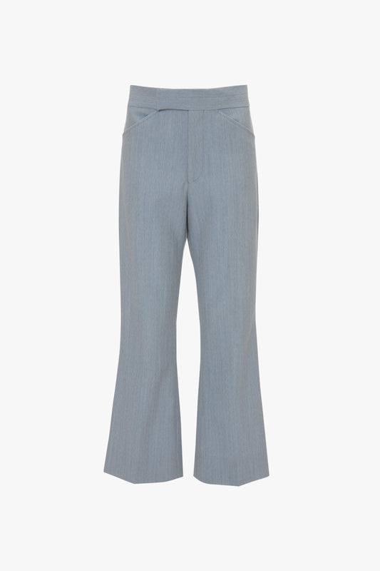 A pair of light gray, wide-legged pants with a tailored fit, featuring front seams and a high waistband, these Exclusive Wide Cropped Flare Trousers In Marina by Victoria Beckham blend modern sophistication with a nod to the 1970s.